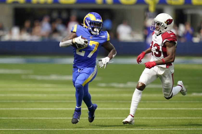 Los Angeles Rams running back Darrell Henderson (27) carries past Arizona Cardinals.