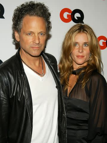 <p>Lawrence Lucier/Getty</p> Lindsay Buckingham and Kristen Messner at the debut party for GQ's new editor-in-chief Jim Nelson on September 4, 2003 in New York City.
