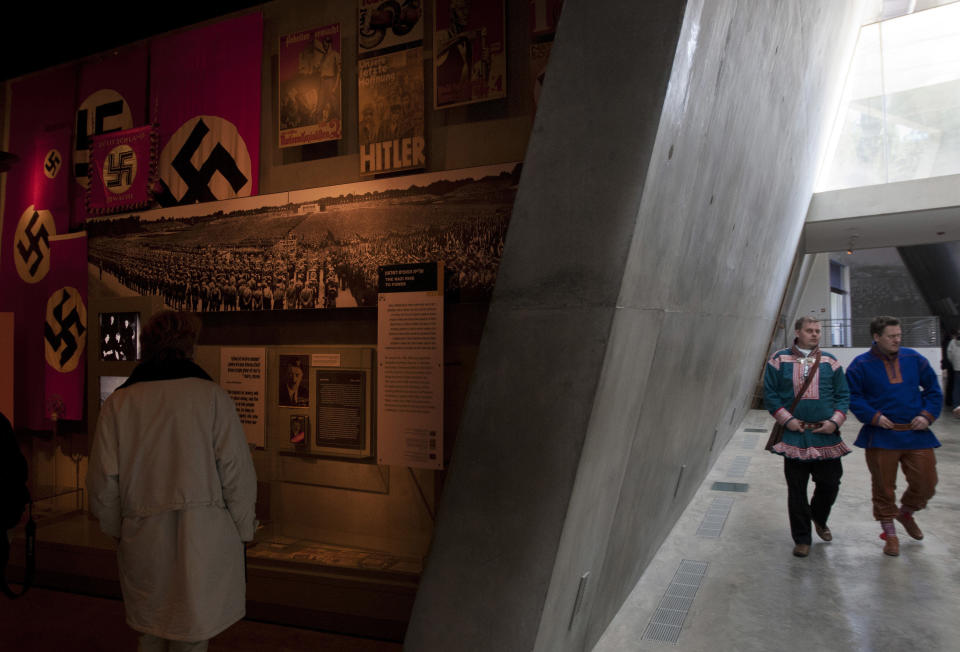 In this photo taken Tuesday, Feb. 21, 2012, Nils Ante Eira, center right, and Lars Joar Halonen, Sami of Norway, visit the Yad Vashem Holocaust memorial in Jerusalem, as part of their stay in Israel, viewed by many as a model for reviving ancient tongues. A delegation of Norway's indigenous Sami people visited Israel this week, to seek help in preserving and expanding their fading native language. According to a senior researcher at the Academy of Hebrew Language the Sami are not the first foreigners to look to Israel for language instruction tips; visitors from the Maori tribes of New Zealand, from Wales and from the Basque region of Spain have come before. (AP Photo/Sebastian Scheiner)