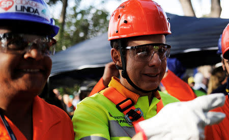 Sao Paulo's Mayor Joao Doria (R) wears a Municipal worker's uniform as he attends the "Pretty City" campaign in Sao Paulo, Brazil, March 25, 2017. REUTERS/Nacho Doce