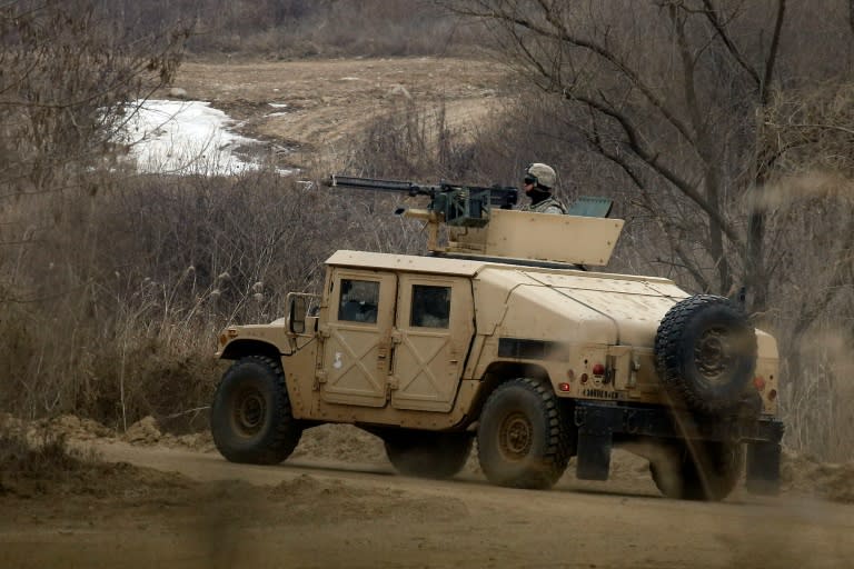 A US soldier stands atop a military humvee at a training ground in Paju, South Korea