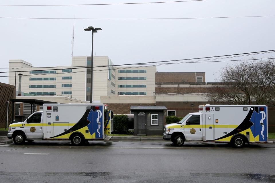 Two ambulances from Chatham EMS sit outside a temproary ambulance entrance at St. Joseph's Hospital on Friday March 10, 2023.