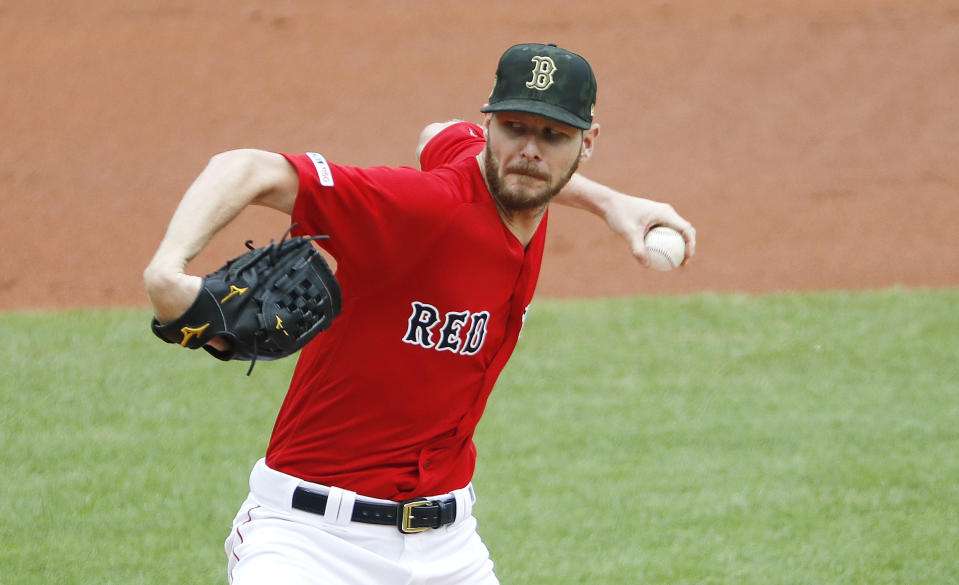 Boston Red Sox starting pitcher Chris Sale delivers against the Houston Astros during the first inning of a baseball game Sunday, May 19, 2019, at Fenway Park in Boston. (AP Photo/Winslow Townson)