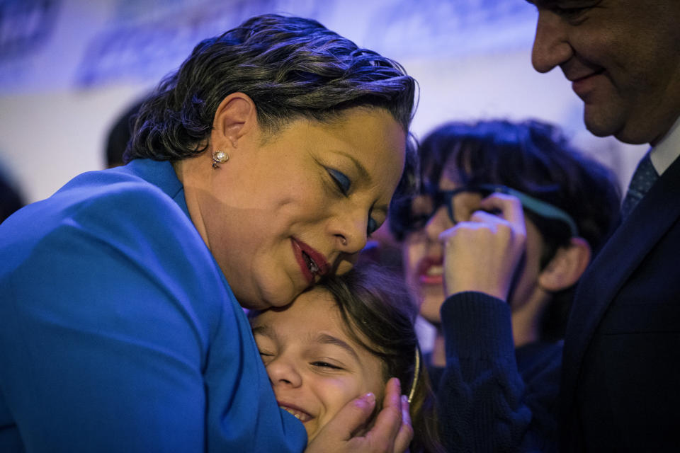 Congresswoman-elect Jennifer McClellan, D-Va., hugs her daughter Samantha Mills at her election party in Richmond, Va., after winning the seat for Virginia's 4th Congressional District on Tuesday, Feb. 21, 2023. McClellan prevailed over right-wing Republican nominee Leon Benjamin. (AP Photo/John C. Clark)