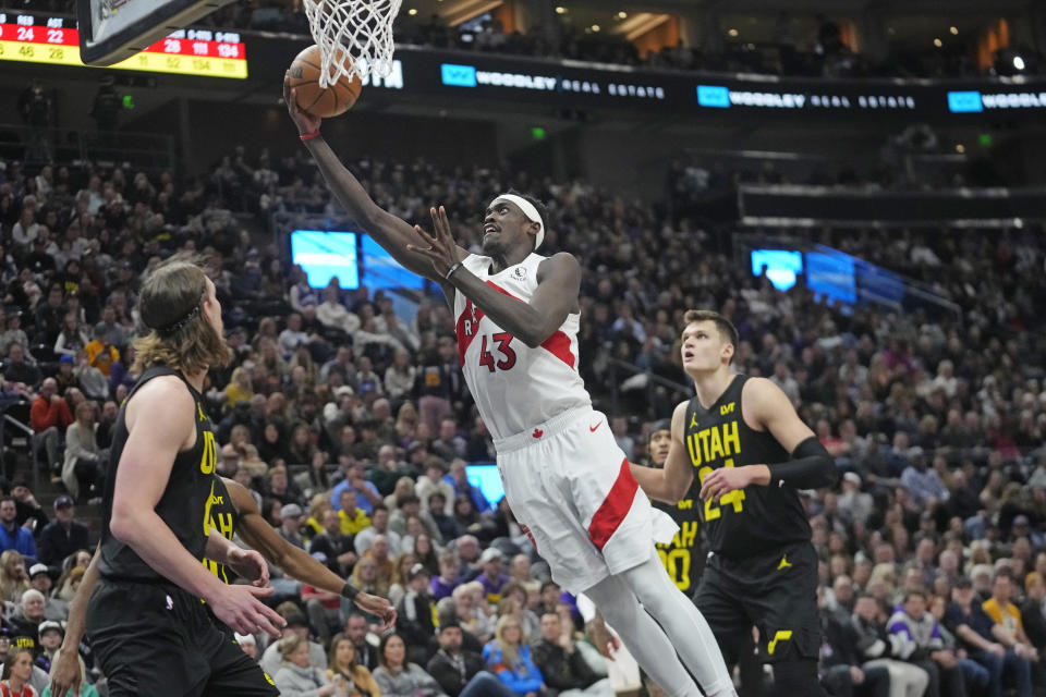 Toronto Raptors forward Pascal Siakam (43) goes to the basket as Utah Jazz's Kelly Olynyk, left, and Walker Kessler (24) watch during the second half of an NBA basketball game Friday, Jan. 12, 2024, in Salt Lake City. (AP Photo/Rick Bowmer)