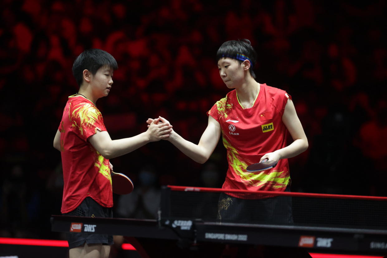 Chinese paddlers Sun Yingsha (left) and Wang Manyu during their women's doubles final at the WTT Singapore Smash 2022. (PHOTO: World Table Tennis)