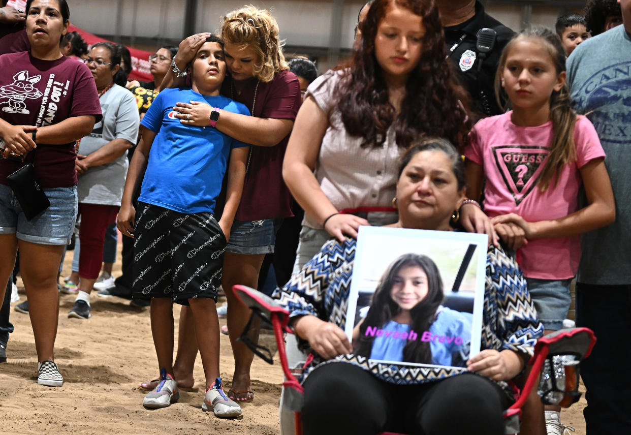 Uvalde, Texas May 25, 2022- Esmerralda Bravo holds a picture of her grandaughter Naveah, a shooting victim, Wednesday at the Uvalde County Fairplex to honor the fallen victims of a mass shooting during a vigil in Texas. Nineteen students and two teachers died when a gunman opened fire in a classroom yesterday. (Wally Skalij/Los Angeles Times via Getty Images)