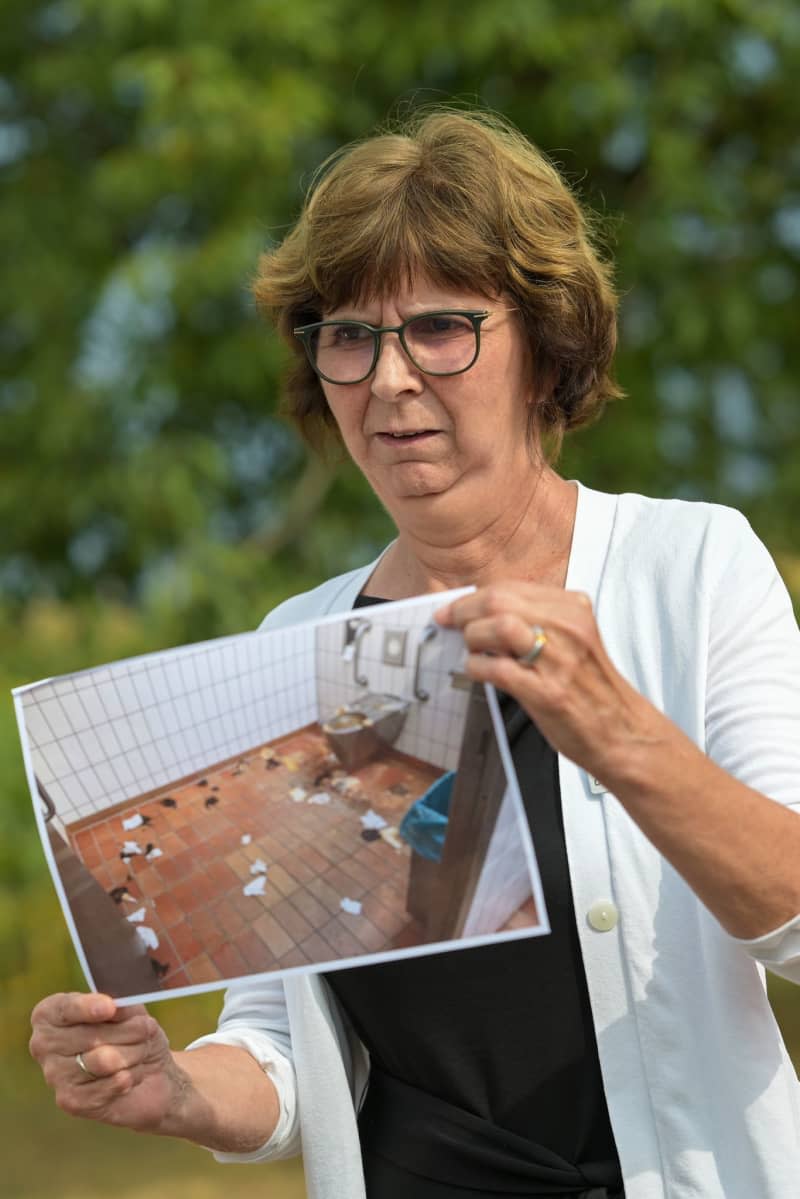 "I see this as a physical assault on our (cleaning) staff," says Christine Baur-Fewson, Director of the south-west branch of Autobahn GmbH, holding up a photo showing the conditions some motorway toilets in Germany are left in. Marius Bulling/dpa