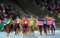 <p>Ashton Eaton of the United States celebrates winning gold overall after the Men’s Decathlon 1500m on Day 13 of the Rio 2016 Olympic Games at the Olympic Stadium on August 18, 2016 in Rio de Janeiro, Brazil. (Photo by Dean Mouhtaropoulos/Getty Images) </p>