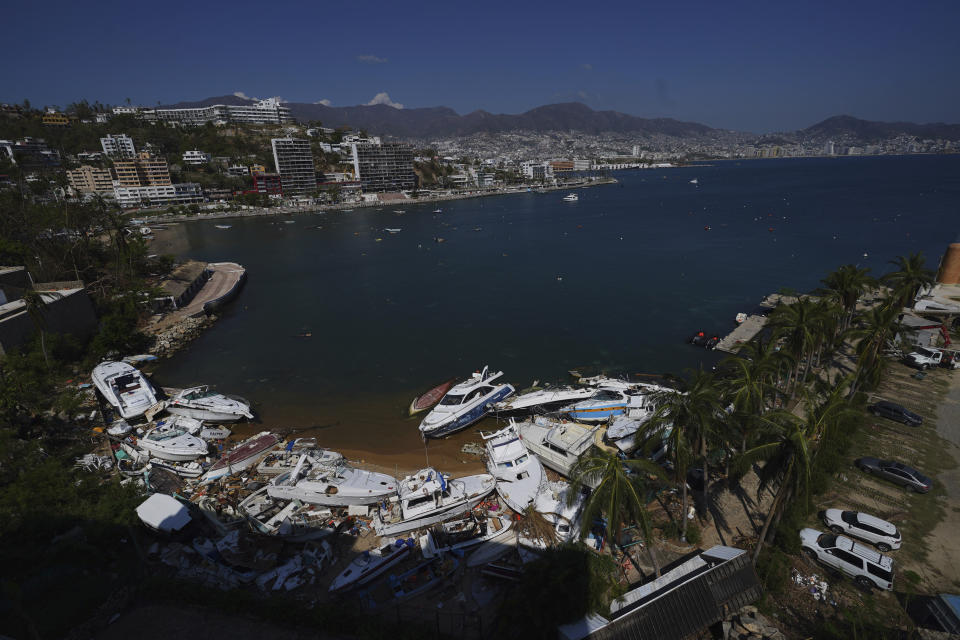 Boats lay in ruins after the passing of Hurricane Otis in Acapulco, Mexico, Sunday, Nov. 12, 2023. It was 12:20 a.m. on Oct. 25. when Hurricane Otis made landfall in this Pacific port city as a Category 5 hurricane, leaving 48 dead, mostly by drowning, and 31 missing, according to official figures. Sailors, fishermen and relatives of crew members believe that there may be more missing because sailors often go to take care of their yachts when a storm approaches. (AP Photo/Marco Ugarte)