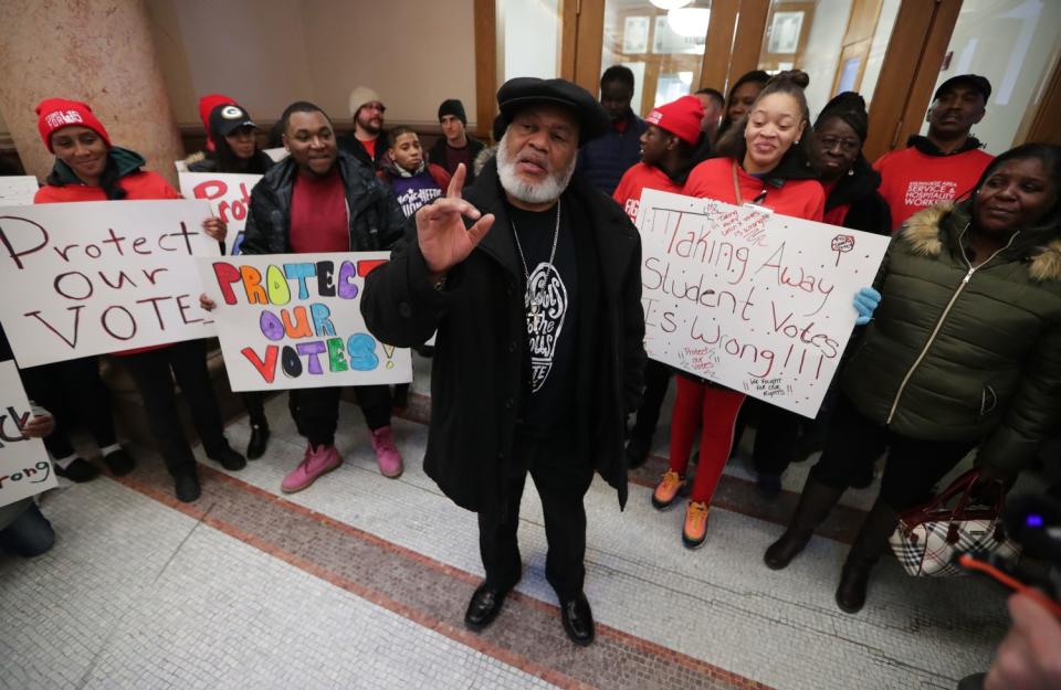 Pastor Greg Lewis leads a rally at Milwaukee City Hall in December 2019.