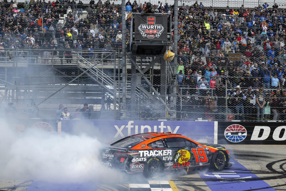 Martin Truex Jr. (19) performs a burnout after winning the NASCAR 400 auto race at Dover Motor Speedway, Monday, May 1, 2023, in Dover, Del. (AP Photo/Jason Minto)