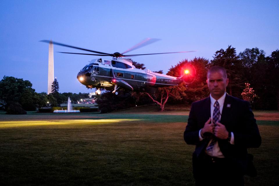 A Secret Service agent keeps watch as President Donald Trump arrives aboard Marine One on the South Lawn of the White House on May 23, 2018 in Washington, DC.  (Getty Images)