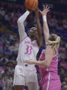 Penn State's Johnasia Cash (33) puts up a shot on Iowa's Monika Czinano (25) during the first half of an NCAA college basketball game, Sunday, Feb. 5, 2023, in State College, Pa. (AP Photo/Gary M. Baranec)