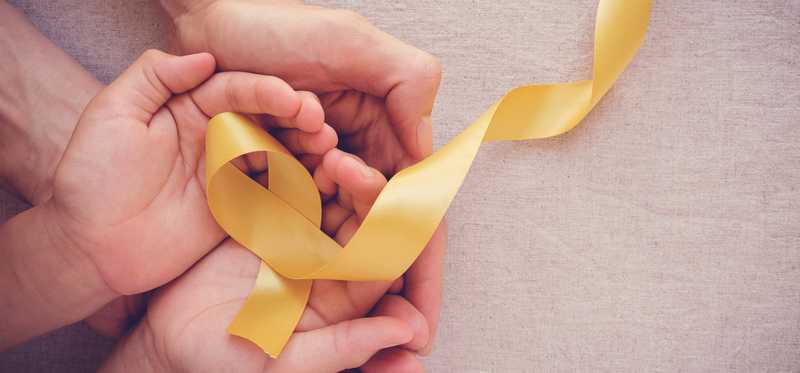 A yellow childhood cancer ribbon.