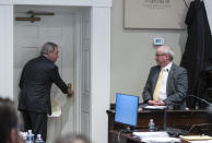 Attorney Dick Harpootlian, left, asks fingerprint examiner Thomas Darnell about leaving fingerprints on door knobs during Alex Murdaugh's double murder trial at the Colleton County Courthouse in Walterboro, S.C., Friday, Feb. 3, 2023. Murdaugh is standing trial on two counts of murder in the shootings of his wife and son at their Colleton County home and hunting lodge on June 7, 2021. (Sam Wolfe/The State, Pool)
