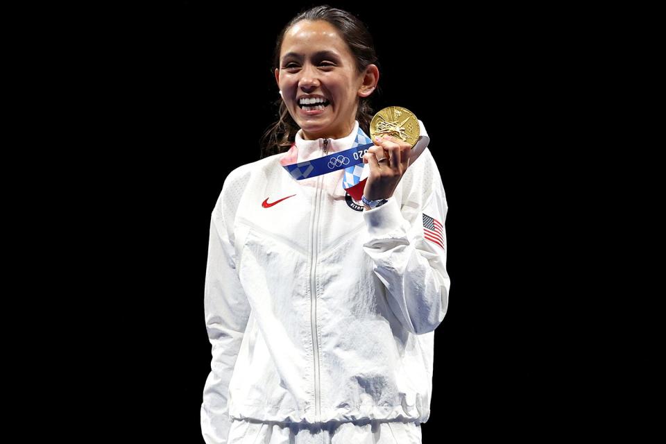 Gold medalist Lee Kiefer of Team United States poses on the podium during the medal ceremony for the Women's Foil Individual Fencing Gold Medal event on day two of the Tokyo 2020 Olympic Games at Makuhari Messe Hall on July 25, 2021 in Chiba, Japan.