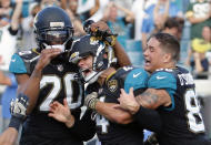 <p>Jacksonville Jaguars kicker Josh Lambo, center, celebrates his game winning 30-yard field goal against the Los Angeles Chargers with teammates cornerback Jalen Ramsey (20) and tight end James OâShaughnessy, right, during the second half of an NFL football game, Sunday, Nov. 12, 2017, in Jacksonville, Fla. Jacksonville won 20-17 in overtime. (AP Photo/Stephen B. Morton) </p>