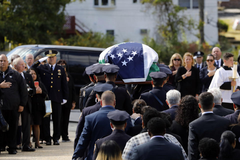 The casket bearing New York City Police Officer Brian Mulkeen is carried into Church of the Sacred Heart, Friday, Oct. 4, 2019, in Monroe, N.Y. Authorities say Mulkeen was fatally hit Sunday by two police bullets while struggling with an armed man in the Bronx. He is the second New York City officer killed by friendly fire this year. (AP Photo/Mark Lennihan)