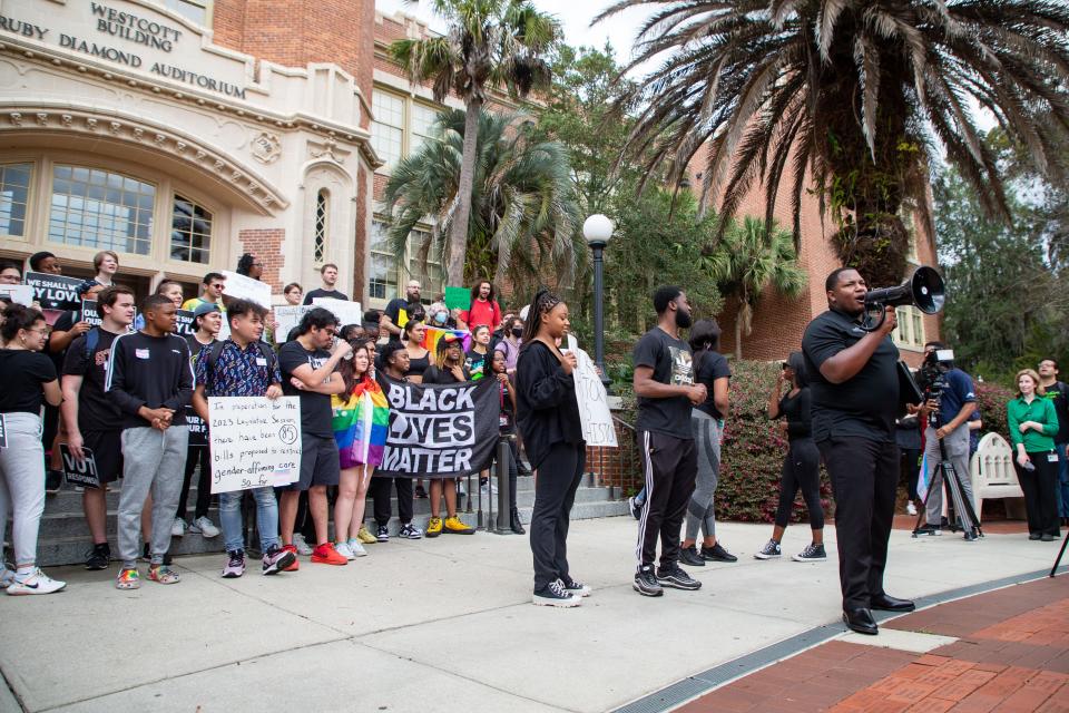 More than 100 people gathered in front of the Westcott Building on Florida State University's campus to protest the DeSantis administration's "attack" on the LGBTQ+ and Black, Indigenous and People of Color (BIPOC) communities on Thursday, Feb. 23, 2023.