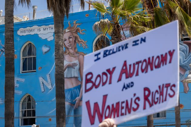 Protesters hold signs in support of bodily autonomy after the Supreme Court's 2022 decision in the Dobbs v. Jackson Women's Health.