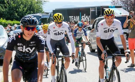 Cycling - The 104th Tour de France cycling race – Rest day, Le Puy en Velay, France - July 17, 2017 - Yellow jersey leader Team Sky rider Chris Froome (CL) of Britain starts training after a media conference during a rest day. REUTERS/Robert Pratta