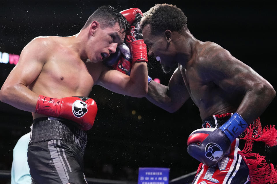 Jermall Charlo, right, fights Juan Macias Montiel during a WBC middleweight world championship boxing match Saturday, June 19, 2021, in Houston. Charlo won the fight. (AP Photo/David J. Phillip)