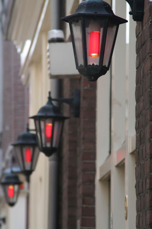 Lamps signal places that practice the oldest profession in the Red Light District in Amsterdam.