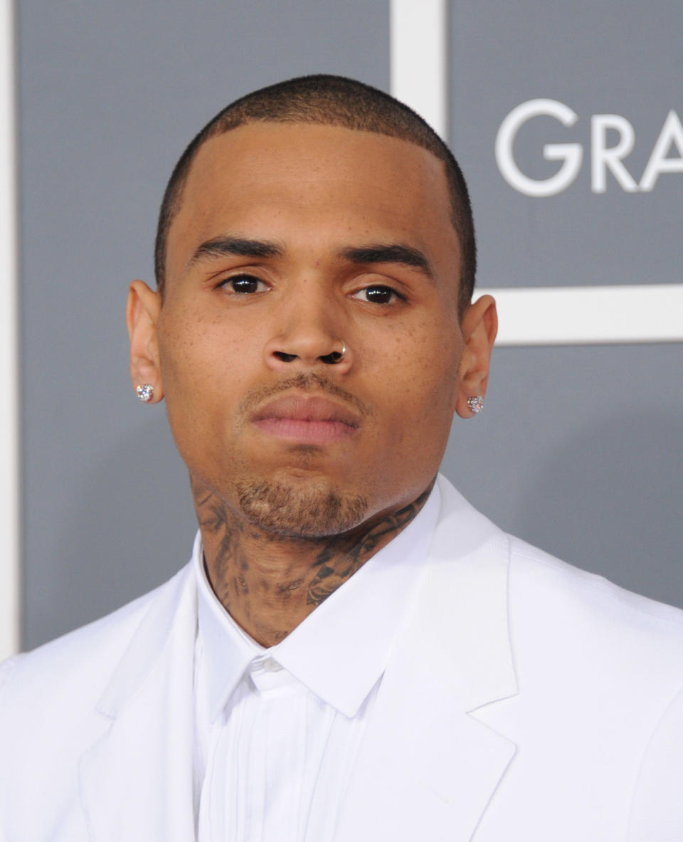 Chris Brown arrives at the 55th annual Grammy Awards on Sunday, Feb. 10, 2013, in Los Angeles. (Photo by Jordan Strauss/Invision/AP)