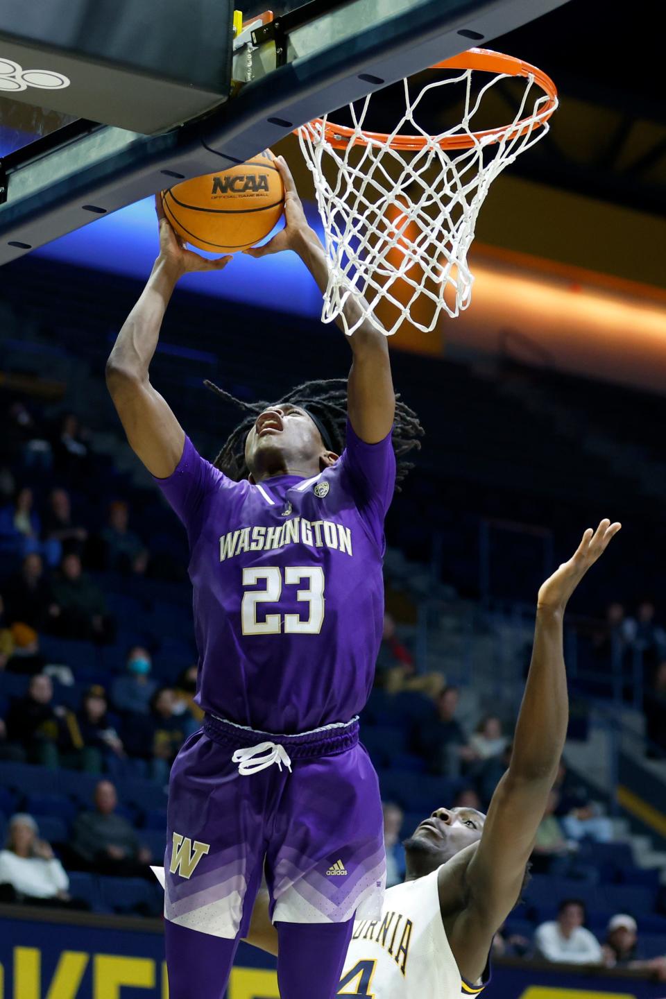 Washington guard Keyon Menifield (23) shoots against California forward Sam Alajiki (24) during the first half of an NCAA college basketball game in Berkeley, Calif., Thursday, Feb. 23, 2023. (AP Photo/Jed Jacobsohn)