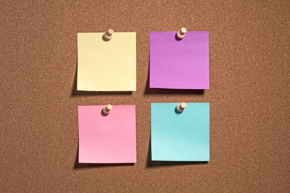 Multi Colored Note Paper on Cork Board