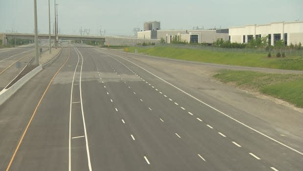 Eight lanes of the Highway 427 extension sit empty. They are off limits to drivers.