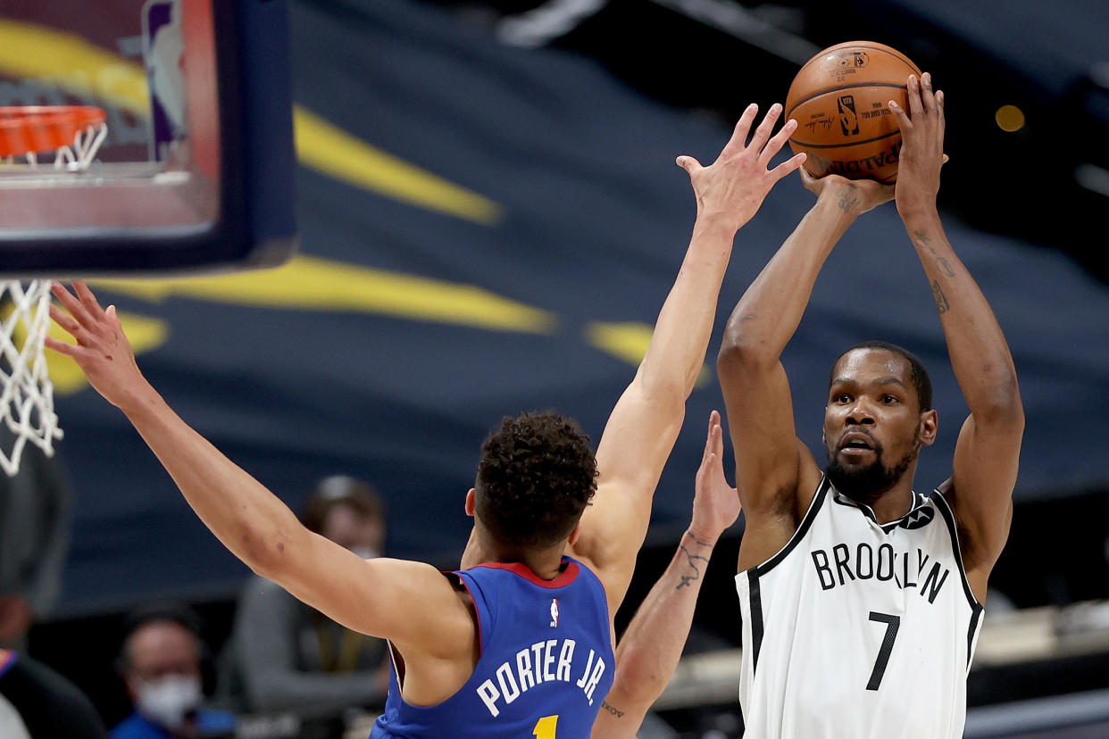 Kevin Durant #7 of the Brooklyn Nets puts up a shot over Michael Porter Jr. #1 of the Denver Nuggets in the fourth quarter at Ball Arena on May 08, 2021 in Denver, Colorado. NOTE TO USER: User expressly acknowledges and agrees that, by downloading and or using this photograph, User is consenting to the terms and conditions of the Getty Images License Agreement. (Photo by Matthew Stockman/Getty Images)