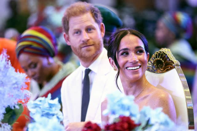 <p>KOLA SULAIMON/AFP via Getty</p> Prince Harry and Meghan Markle in Nigeria on May 11, 2024