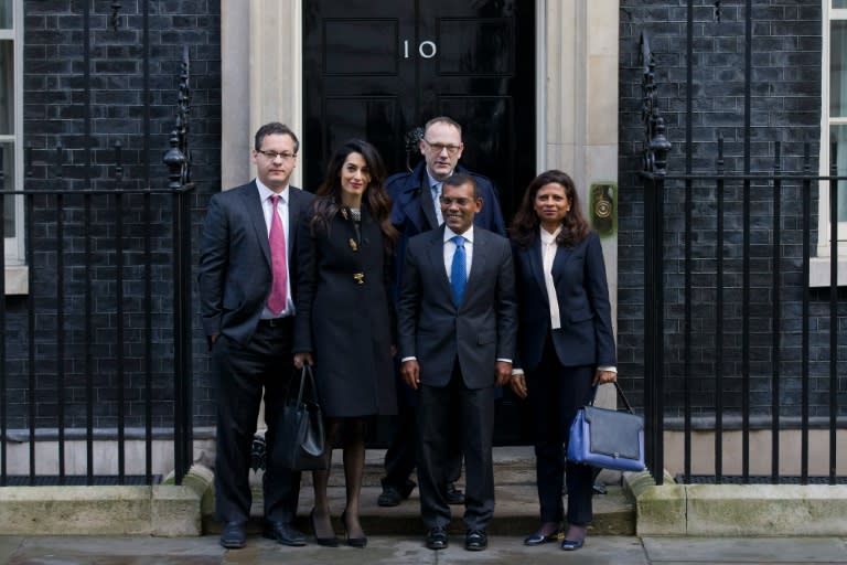 Former Maldives president Mohamed Nasheed (2nd R) his wife Laila Ali Abdulla (R) and British lawyer Amal Clooney (2nd L) pose for photographers as they leave 10 Downing Street in London on January 23, 2016