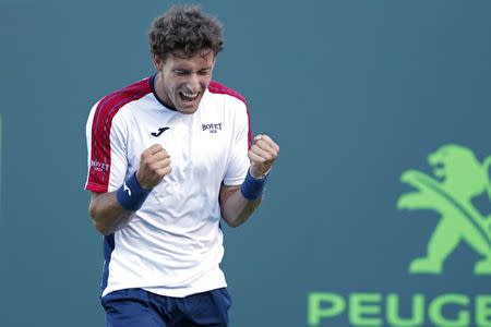 Mar 29, 2018; Key Biscayne, FL, USA; Pablo Carreno Busta of Spain celebrates after match point against Kevin Anderson of South Africa (not pictured) on day ten of the Miami Open at Tennis Center at Crandon Park. Mandatory Credit: Geoff Burke-USA TODAY Sports