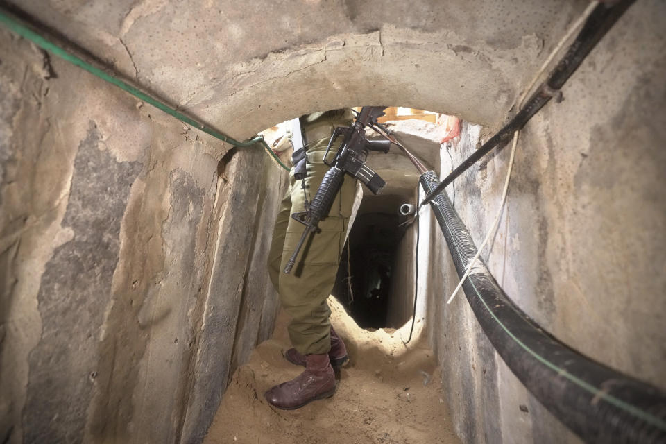 An Israeli soldier stands in an underground tunnel found underneath Shifa Hospital in Gaza City, Wednesday, Nov. 22, 2023. Israel says that Hamas militants sought cover on the grounds of the hospital and used the tunnel for military purposes. (AP Photo/Victor R. Caivano)