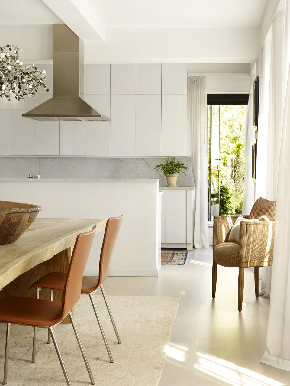 “Someone once asked why I have a rug in the kitchen, and my feeling is that the whole apartment has to be a movement. Plus, it’s not like I’m making roast dinners!” Corner chair procured from charity fundraiser Design on a Dime.