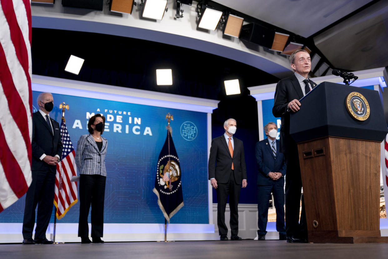 From left, President Joe Biden, Commerce Secretary Gina Raimondo, Sen. Rob Portman, R-Ohio, and Sen. Sherrod Brown, D-Ohio, listen as Intel CEO Patrick Gelsinger, speaks about Intel's announcement to invest in an Ohio chip making facility, at the South Court Auditorium in the Eisenhower Executive Office Building on the White House Campus in Washington, Friday, Jan. 21, 2022. (AP Photo/Andrew Harnik)