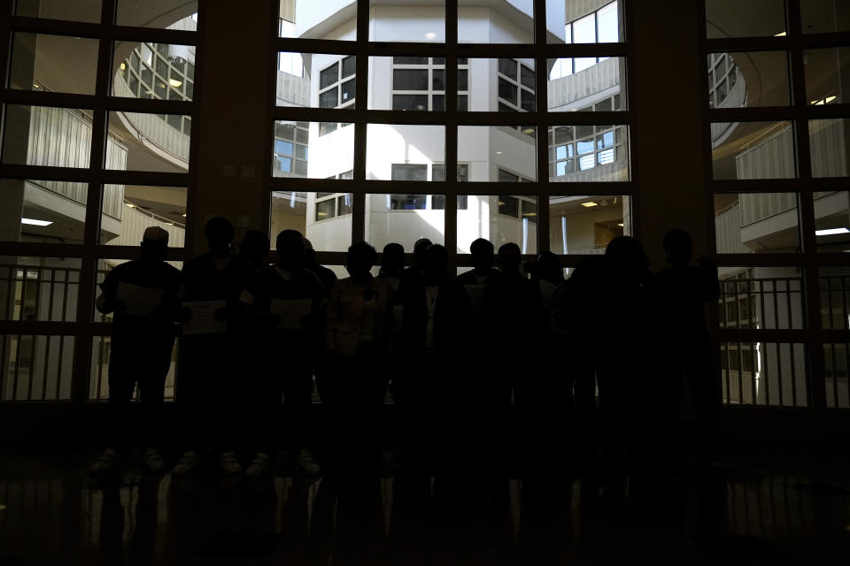 Detainees and DePaul students gather after a book club at Department Of Corrections Division 11 in Chicago, Monday, April 22, 2024. DePaul students and detainees are currently reading Dead Man Walking and the author, anti death penalty advocate, Sister Helen Prejean attended to lead a discussion. (AP Photo/Nam Y. Huh)