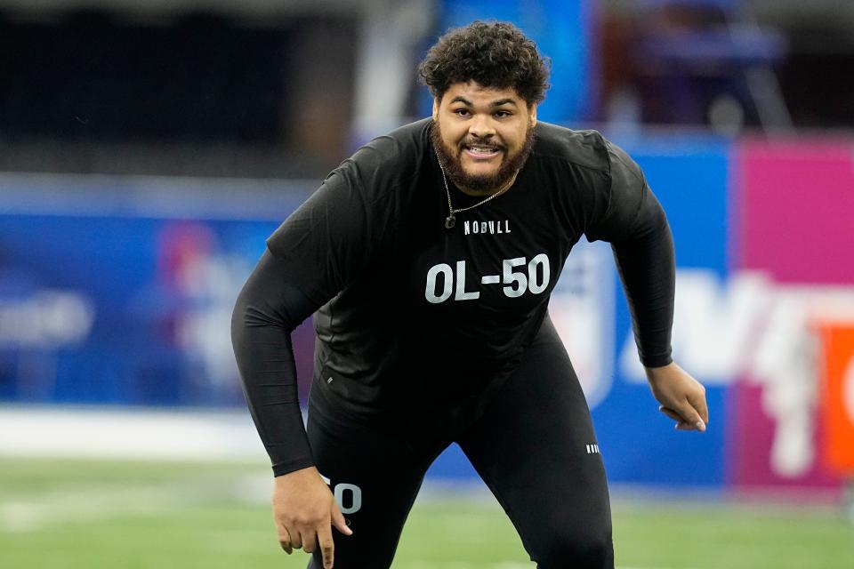 Tennessee offensive lineman Darnell Wright runs a drill at the NFL football scouting combine in Indianapolis, Sunday, March 5, 2023. (AP Photo/Darron Cummings)