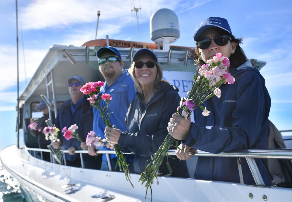 Jackie Warren, right, of West Jeff, Ohio, and her sister, Kathy Monette of Fort Myers, watch as memorial pet reef balls are deployed at the M2 artificial reef site offshore of Sarasota on Wednesday, Jan. 18, 2023. Warren dedicated a reef ball containing the ashes of two of her dogs, Buddie and Cali.