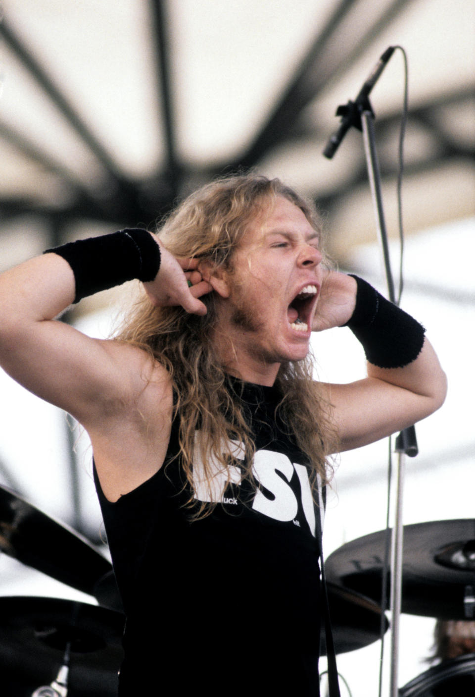 Metallica frontman James Hetfield performing on stage. Circa 1991