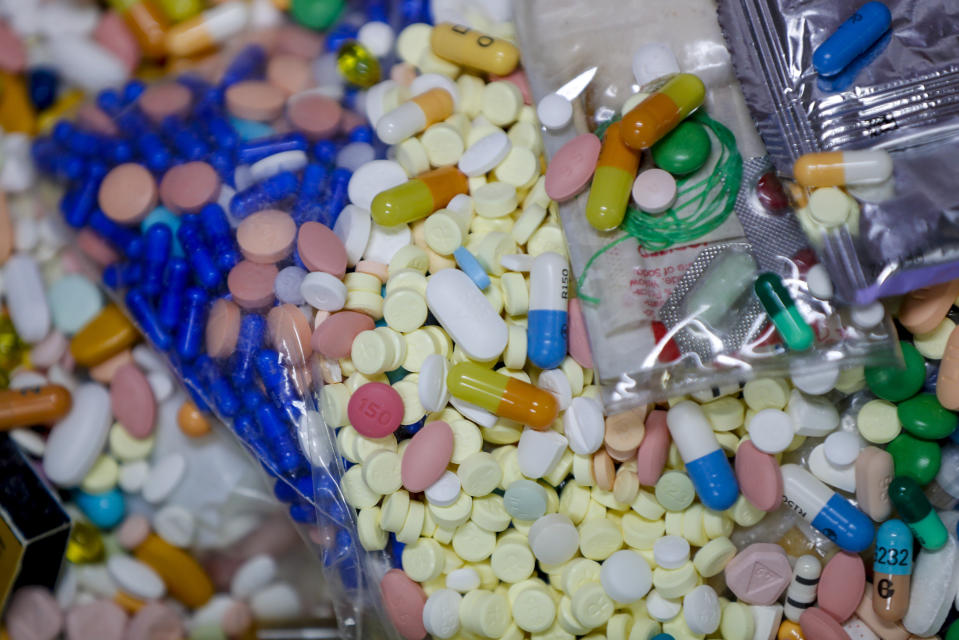 FILE - In this Sept. 11, 2019, file photo, medications slated for destruction are shown in a locked storage area of the police department in Barberton, Ohio. The tentative settlement involving the opioid crisis and the maker of OxyContin, Purdue Pharma, could mean that thousands of local governments will one day be paid back for some of the costs of responding to the epidemic. (AP Photo/Keith Srakocic, File)