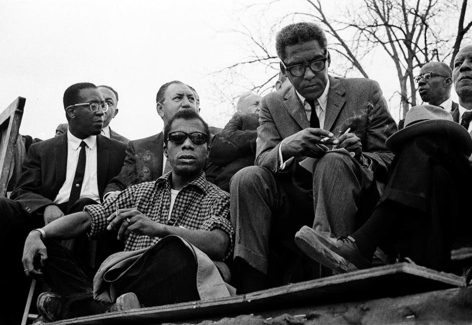 Bayard Rustin, at right, sits next to acclaimed writer James Baldwin on the speakers’ platform in Montgomery, Ala., during the 1965 civil rights march from Selma. <a href="https://www.gettyimages.com/detail/news-photo/speakers-platform-1965-selma-to-montgomery-alabama-civil-news-photo/459534210?phrase=bayard%20rustin%20randolph&adppopup=true" rel="nofollow noopener" target="_blank" data-ylk="slk:Stephen F. Somerstein/Getty Images;elm:context_link;itc:0;sec:content-canvas" class="link ">Stephen F. Somerstein/Getty Images</a>