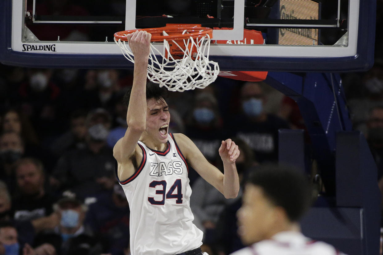 Gonzaga center Chet Holmgren reacts after his dunk during the first half of an NCAA college basketball game against Bellarmine, Friday, Nov. 19, 2021, in Spokane, Wash. (AP Photo/Young Kwak)