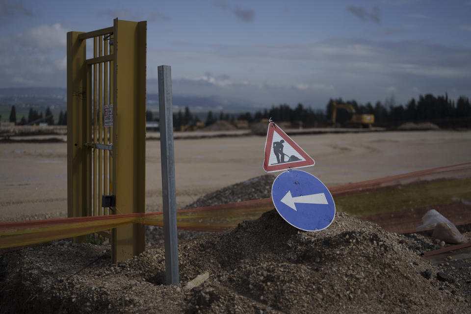 A sign is displayed at a construction site where houses will be built for displaced residents of Kibbutz Nahal Oz, at Kibbutz Mishmar HaEmek, northern Israel, Sunday, Feb. 4, 2024. (AP Photo/Leo Correa)