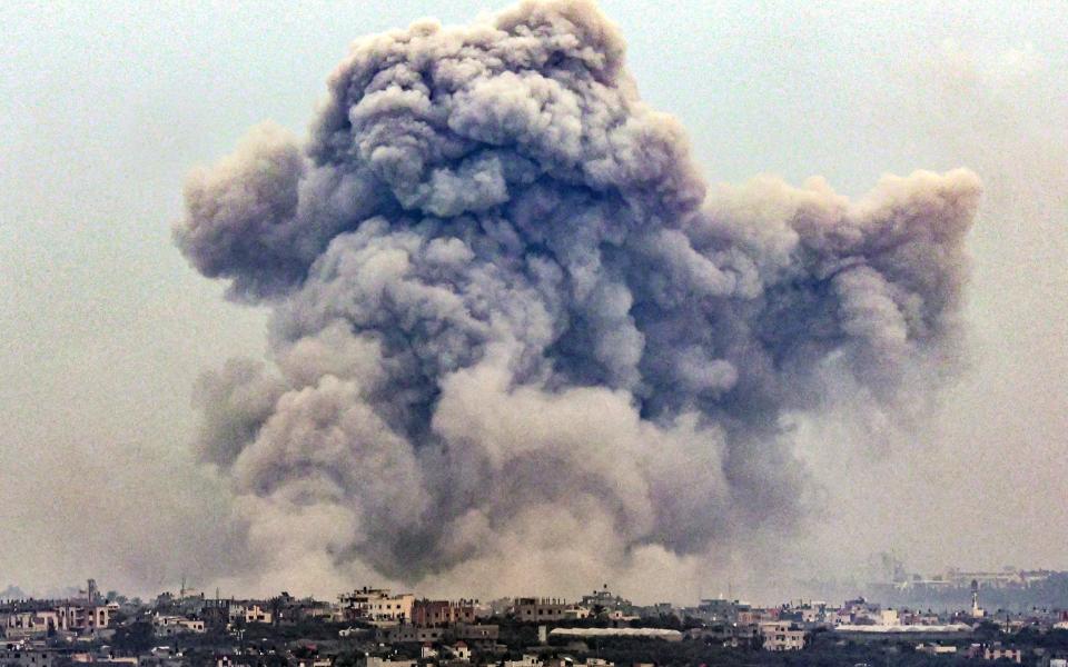 Smoke billows over Khan Yunis from Rafah in the southern Gaza strip