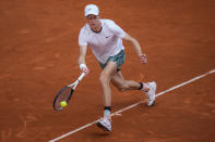 Jannik Sinner, of Italy, returns the ball to Karen Khachanov, of Russia, during the Mutua Madrid Open tennis tournament in Madrid, Tuesday, April 30, 2024. (AP Photo/Manu Fernandez)