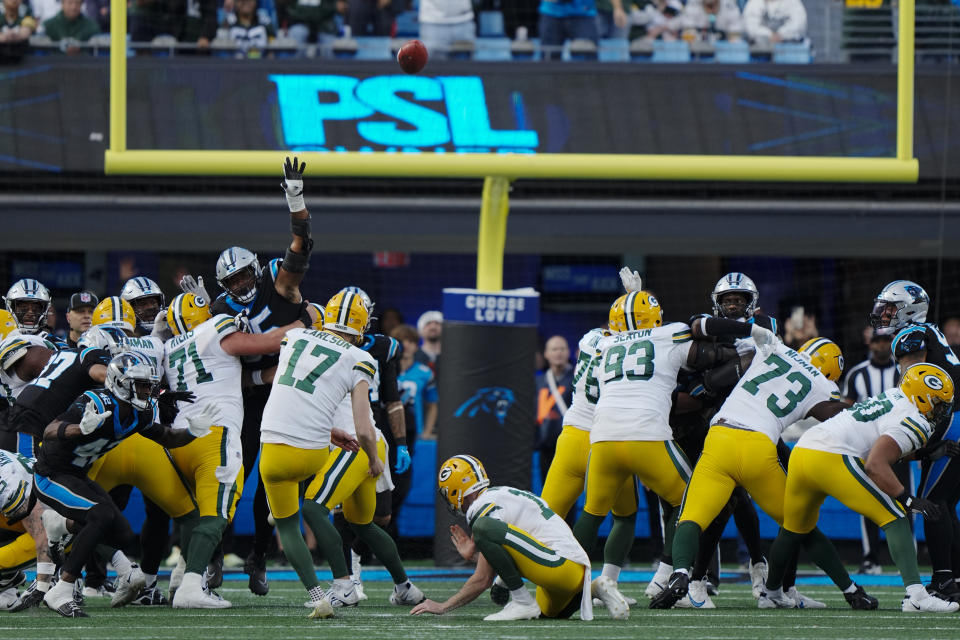 Green Bay Packers place-kicker Anders Carlson kicks a field goal against the Carolina Panthers during the second half of an NFL football game Sunday, Dec. 24, 2023, in Charlotte, N.C. (AP Photo/Rusty Jones)